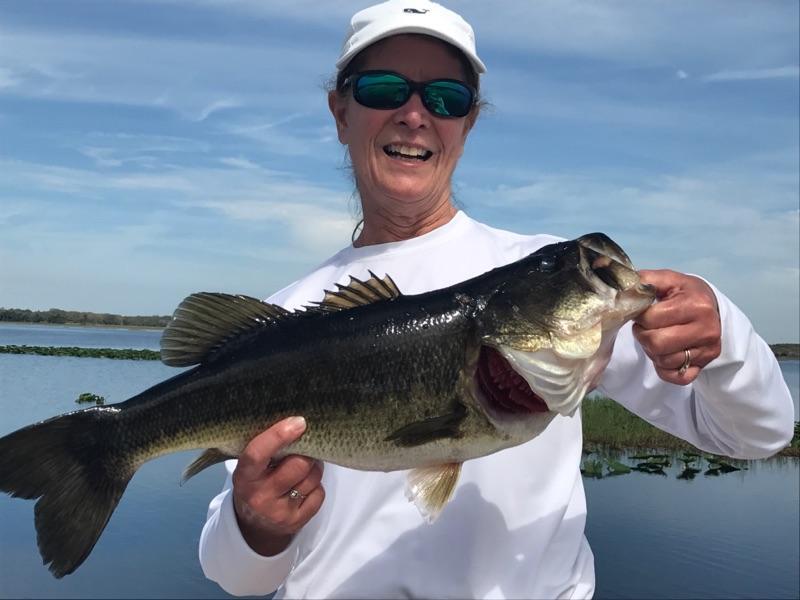 Angler showing off a big largemouth bass catch on Lake Toho