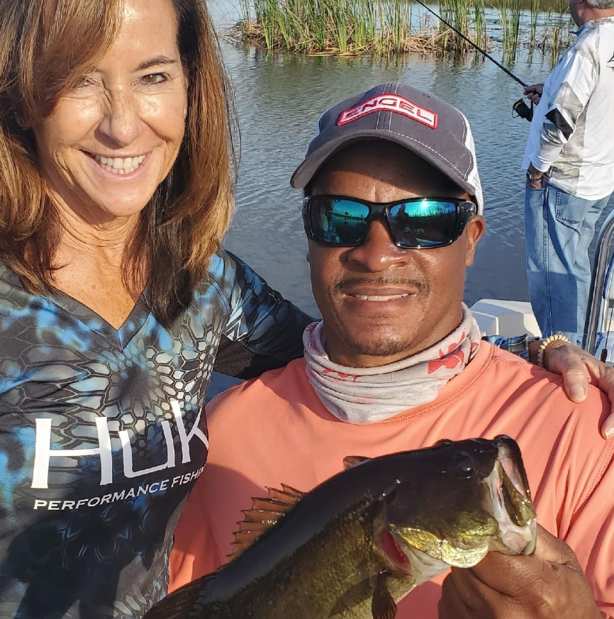 Anglers fishing in Florida with a great bass catch